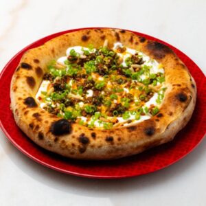 Labneh, Spicy Scallion and Roasted Pine Nuts Khubz Pizza (G,D,N)